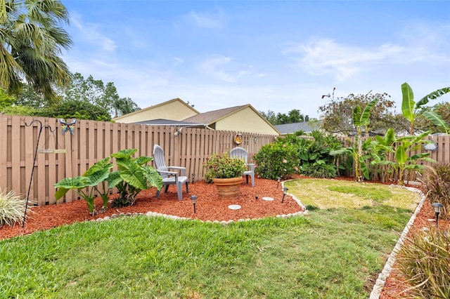 view of yard with a fenced backyard