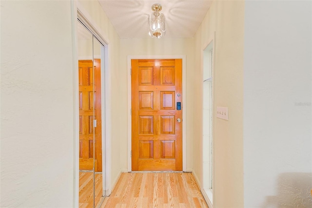 hall with light wood-type flooring