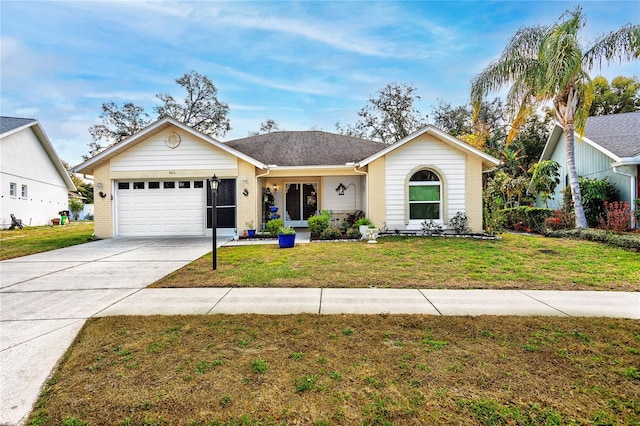 ranch-style house with a garage, concrete driveway, brick siding, and a front lawn