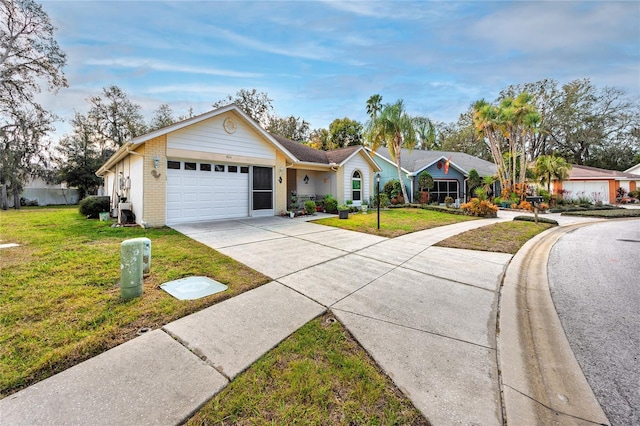 ranch-style home featuring a garage, driveway, brick siding, and a front yard