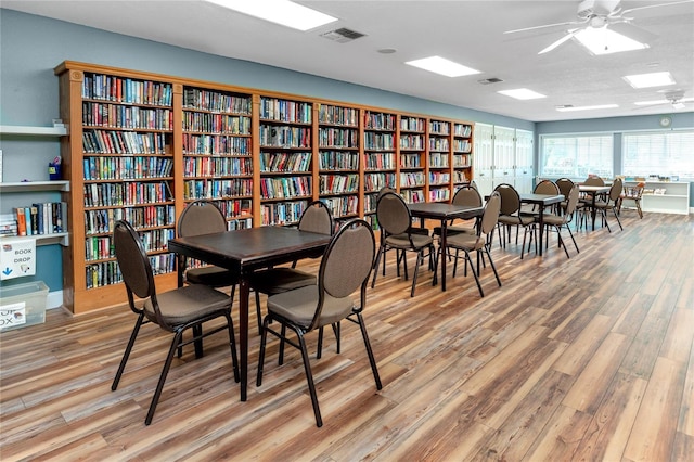 dining room with visible vents, ceiling fan, and light wood-style flooring