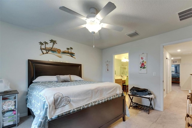 bedroom with visible vents and light colored carpet