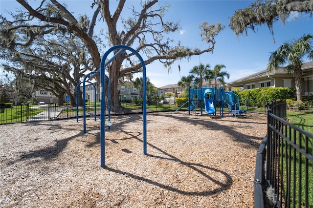 community jungle gym featuring fence