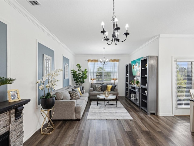 living area with a notable chandelier, dark wood-style flooring, visible vents, baseboards, and crown molding