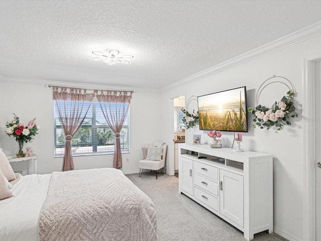 bedroom featuring light carpet, a textured ceiling, baseboards, and crown molding