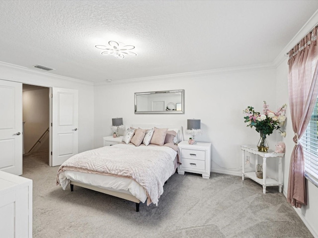 bedroom with light carpet, visible vents, and ornamental molding