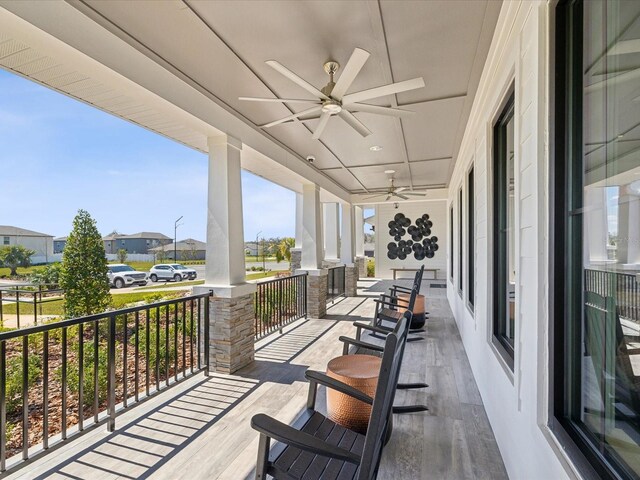 exterior space with ceiling fan