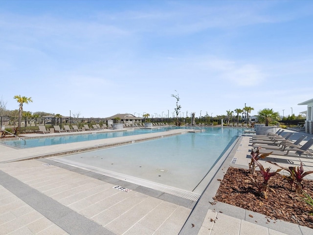 pool featuring a patio and fence