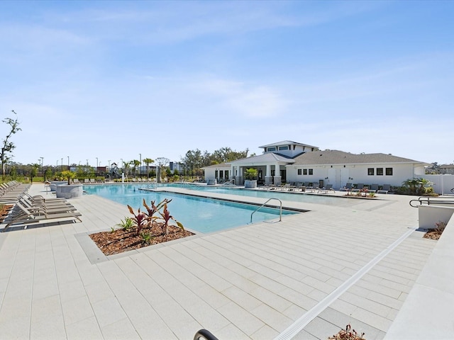 pool with a patio area