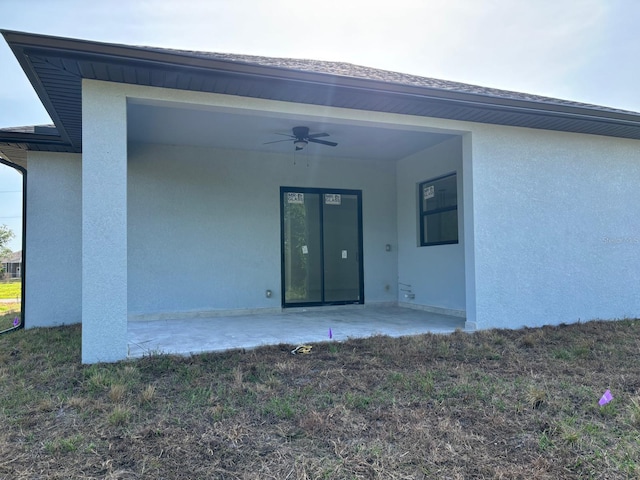 9 Tee View Rd, Rotonda West, FL 33947 - rear view of property with stucco siding, ceiling fan, and a patio area