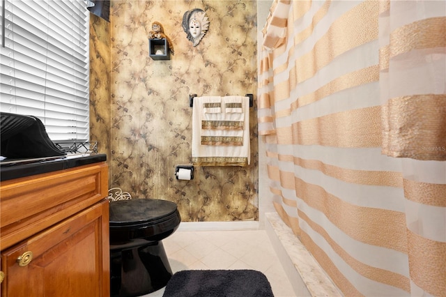 bathroom featuring wallpapered walls, baseboards, toilet, tile patterned floors, and curtained shower