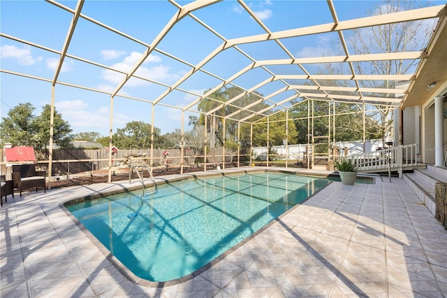 view of swimming pool with a lanai, a fenced backyard, a fenced in pool, and a patio