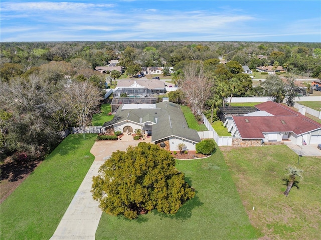 aerial view with a residential view and a view of trees