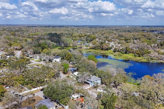 bird's eye view with a water view and a view of trees