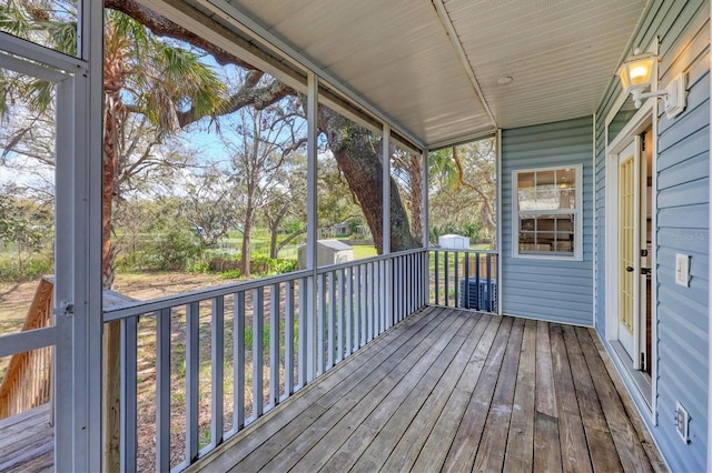 wooden deck with an outdoor structure