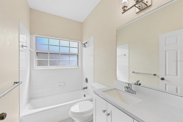 bathroom featuring toilet, vanity, and bathing tub / shower combination