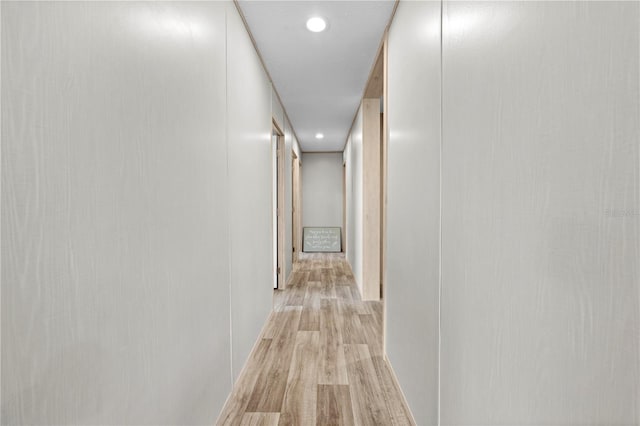 corridor with light wood-type flooring