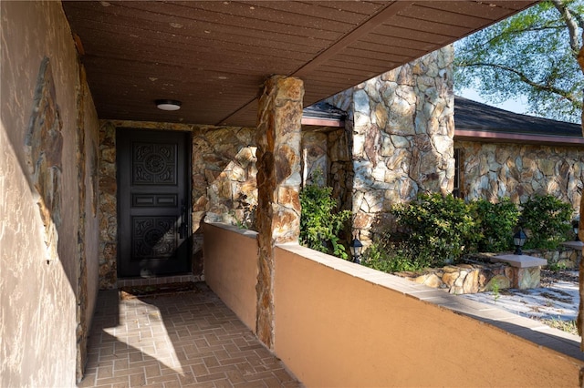 exterior space with stone siding