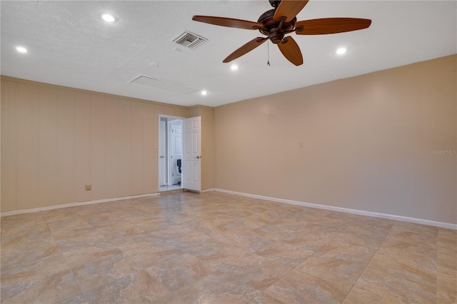 spare room with ceiling fan, recessed lighting, visible vents, baseboards, and attic access