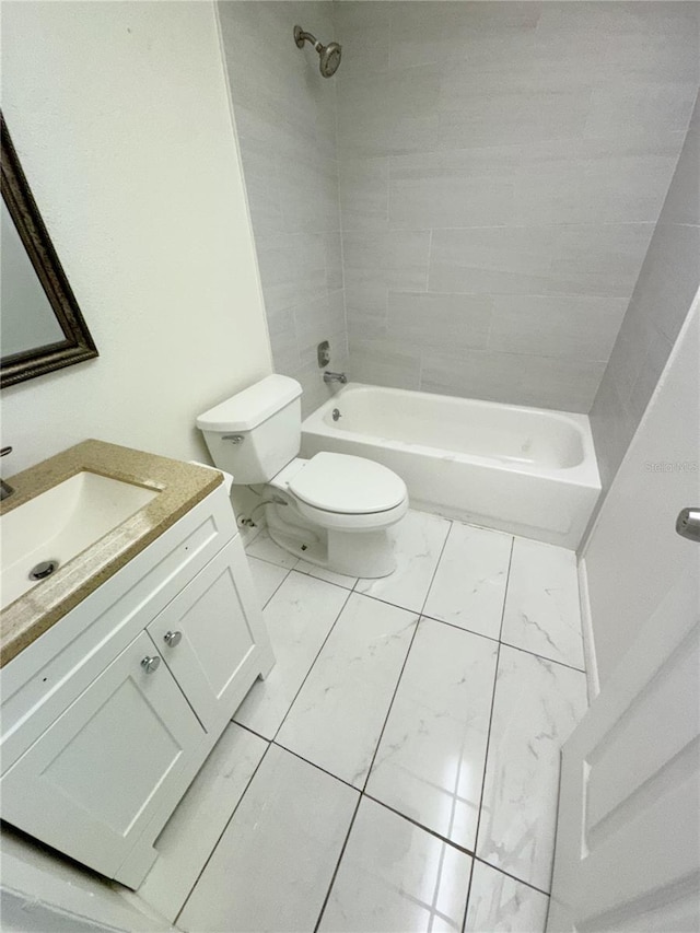 3300 Fox Chase Cir N Unit 229, Palm Harbor, FL 34683 - bathroom with marble finish floors, toilet, tub / shower combination, and vanity
