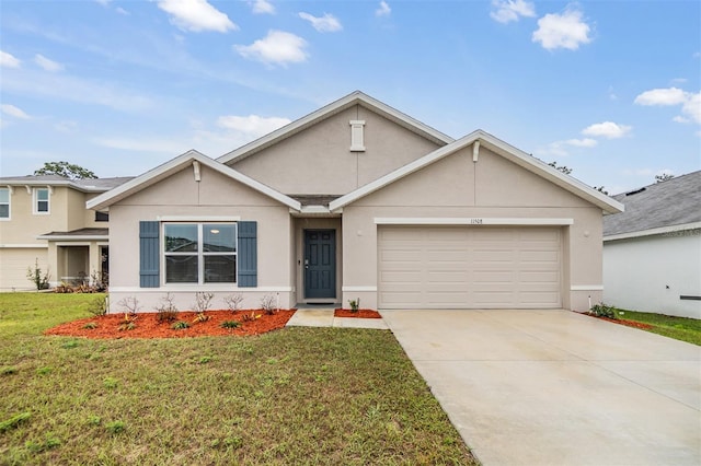 view of front of house with a garage, a front yard, driveway, and stucco siding