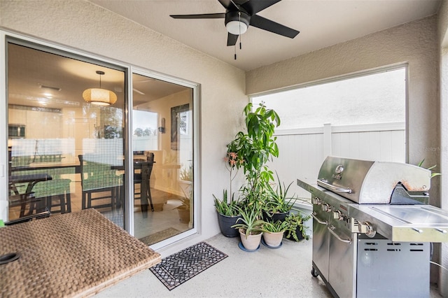 sunroom with a ceiling fan