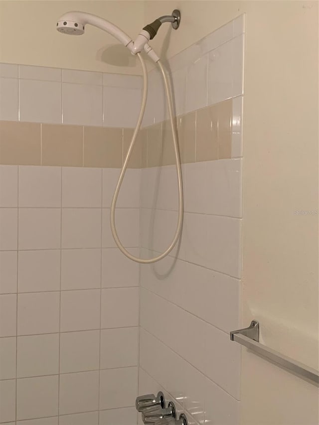 bathroom with a tile shower