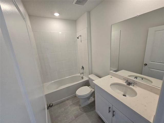 full bathroom with visible vents, toilet, washtub / shower combination, vanity, and tile patterned floors