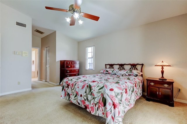 bedroom featuring carpet floors, visible vents, and baseboards