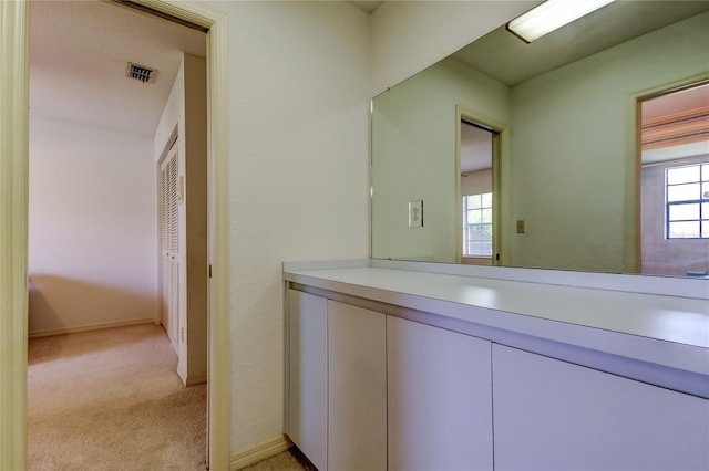 bathroom featuring visible vents and baseboards