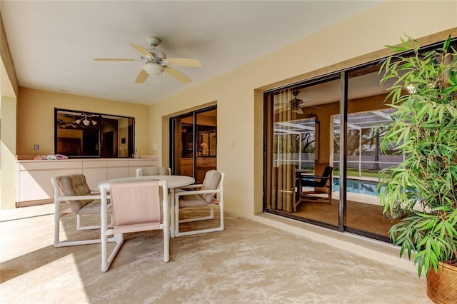 interior space featuring outdoor dining area and a ceiling fan