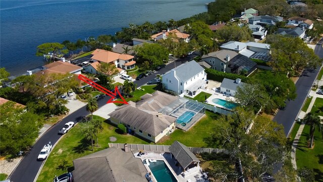 bird's eye view with a residential view and a water view