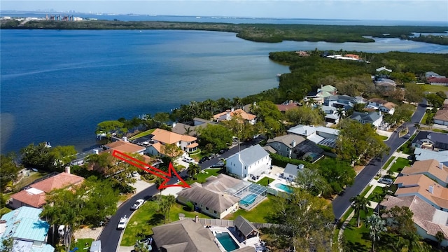 drone / aerial view featuring a water view and a residential view