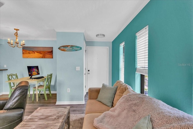 living room with ornamental molding, plenty of natural light, and wood finished floors