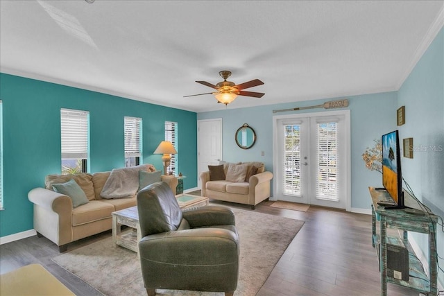 living area featuring a ceiling fan, baseboards, wood finished floors, and french doors