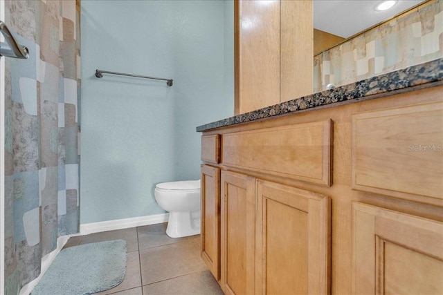 full bathroom with a shower with shower curtain, tile patterned flooring, toilet, and baseboards