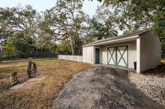 view of yard with an outdoor structure and fence