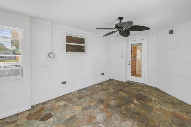 view of patio featuring cooling unit and a ceiling fan