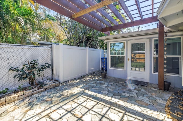 view of patio / terrace with fence and a pergola