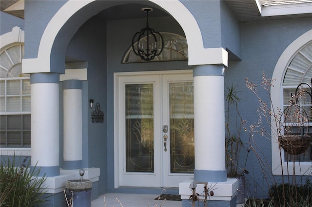 doorway to property with stucco siding and french doors