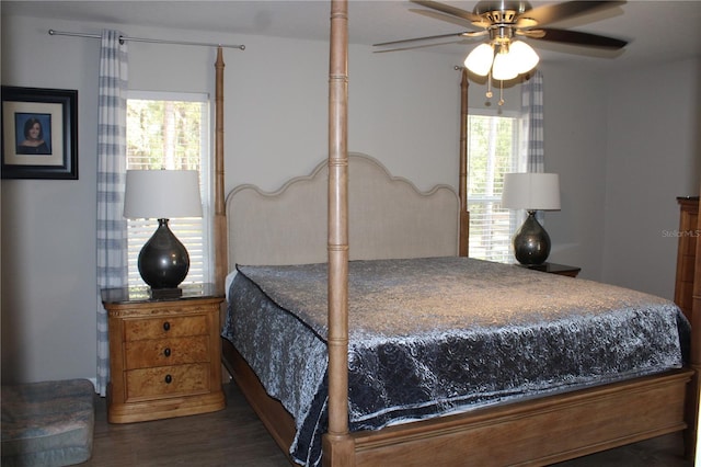 bedroom with multiple windows, a ceiling fan, and wood finished floors