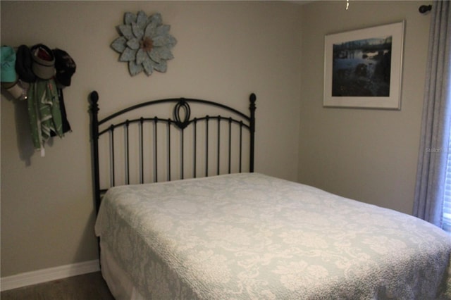 bedroom featuring baseboards