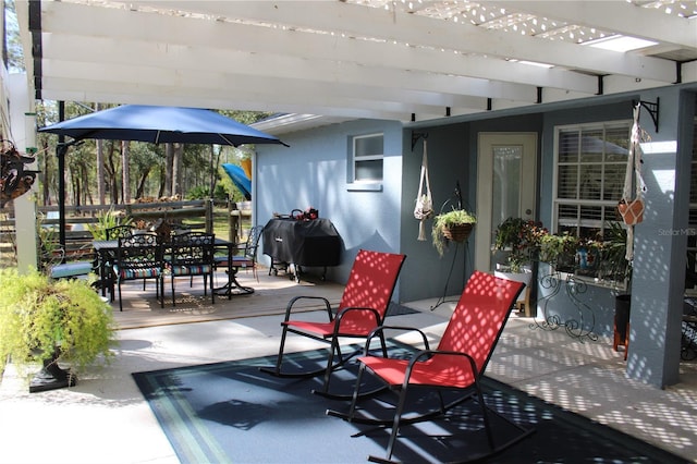 view of patio / terrace with outdoor dining space, fence, grilling area, and a pergola