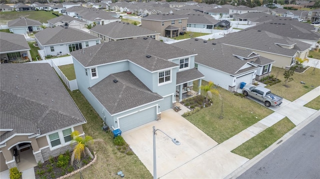 birds eye view of property with a residential view