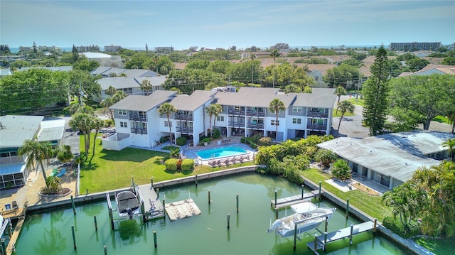 birds eye view of property featuring a water view and a residential view