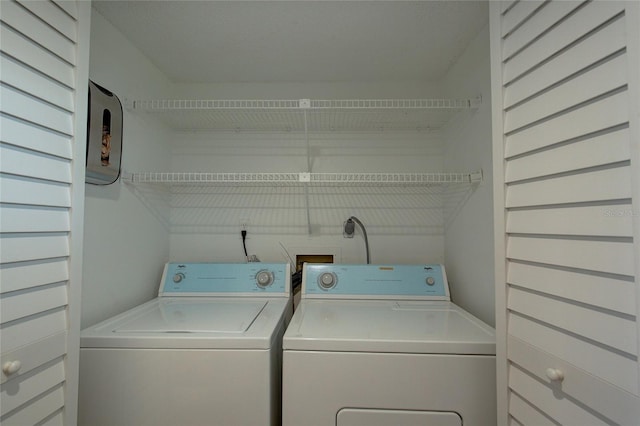 laundry area with laundry area and independent washer and dryer