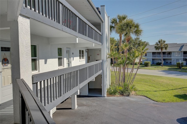 exterior space featuring a residential view and a yard