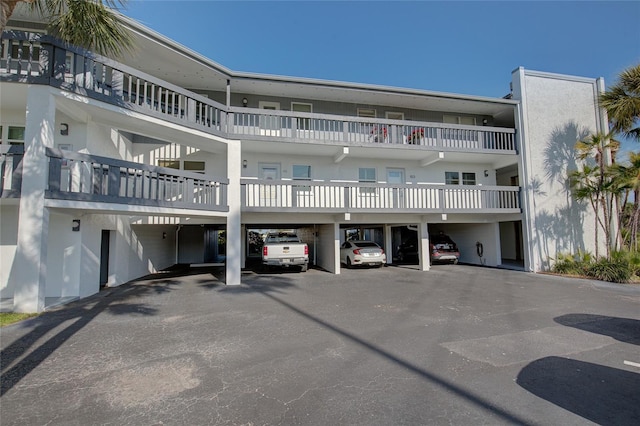 view of property featuring covered parking