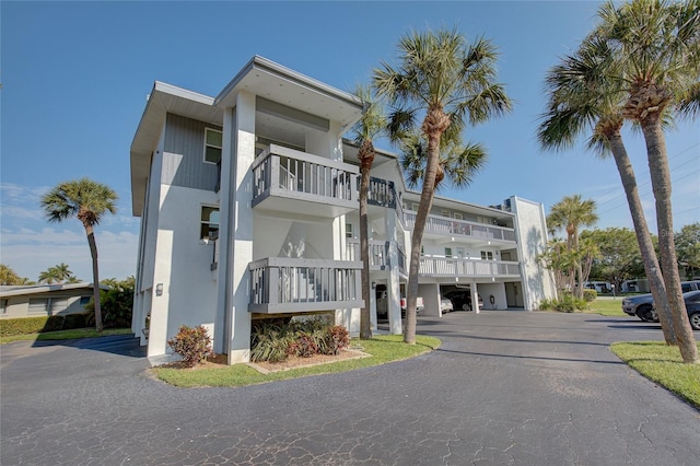 view of property with uncovered parking