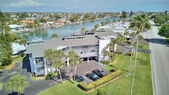 birds eye view of property with a water view